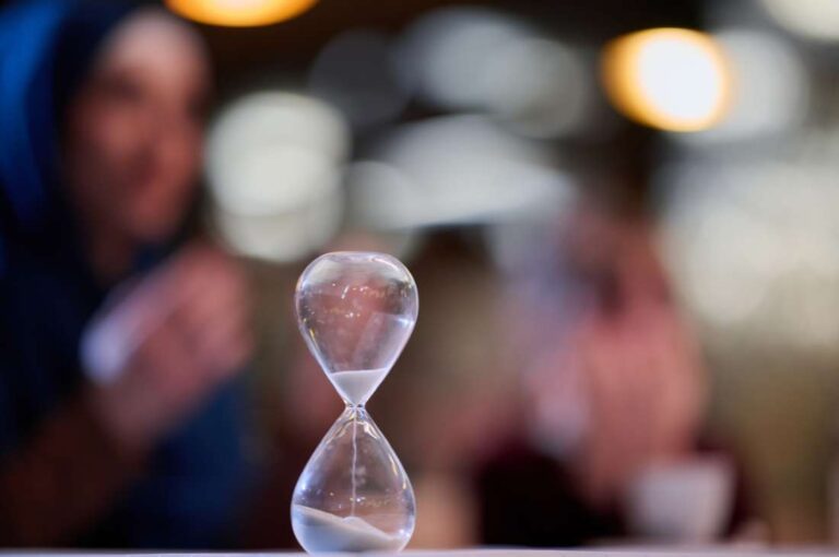 Hourglass with sand representing timing the sale to maximize business value
