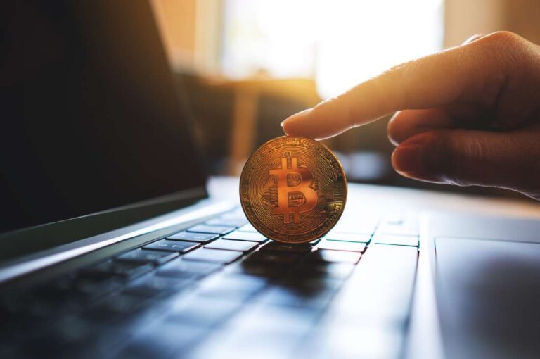Cryptocurrency on a laptop representing reporting changes proposed in August 2025 Proposals