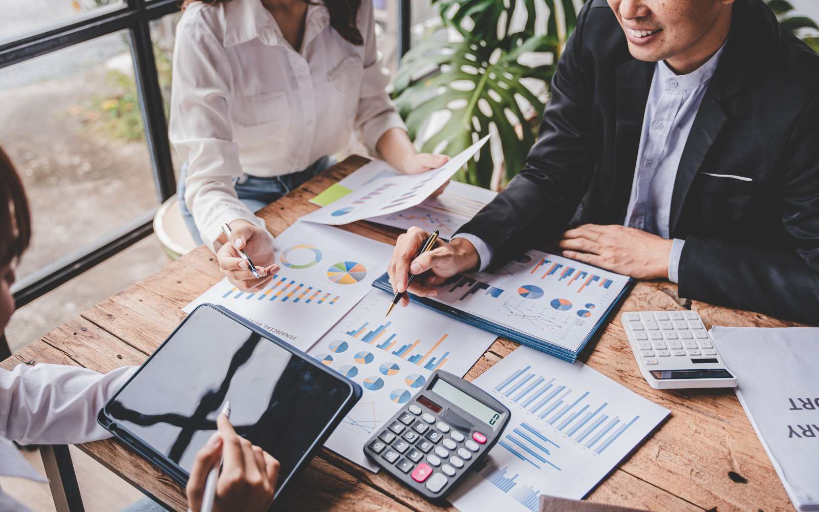 NVS microblog - when to hire an accountant for your business website header image showing business owner consulting with CPA
